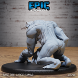 Broad-backed reptilian creature crouched low, coiled haunches and heavy musculature prominent, small serpentine head turned to one side with mouth open, clawed feet gripping the large oval base. Sculpt by Epic Miniatures.