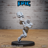 Long-haired broad-shouldered warrior mid-charge, swinging a massive bolted mechanical maul overhead with both hands. Spiked pauldrons, layered armour, skull kneepads, one leg raised. Sculpt by Epic Miniatures.