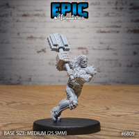 Long-haired broad-shouldered warrior mid-charge, swinging a massive bolted mechanical maul overhead with both hands. Spiked pauldrons, layered armour, skull kneepads, one leg raised. Sculpt by Epic Miniatures.