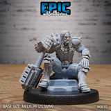 Broad-shouldered male brute crouching low, wielding a massive double-headed spiked maul with riveted iron plating and skull-decorated grip guards, wearing spike-shouldered heavy armour with long lank hair, resting on a stone slab base. Sculpt by Epic Miniatures.