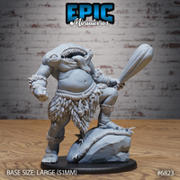 Headless Blemmyes monstrosity with a gaping toothed mouth in its chest, raising a thick wooden club, wearing a feathered hide skirt and rope bindings, one foot on a rocky scenic base. Sculpt by Epic Miniatures.
