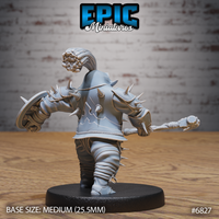 Rear view of a spike-covered armoured warrior, showing a knotted bun beneath a feathered helmet plume, embossed back plate, studded leg wrappings, and spikes across every armour panel. Sculpt by Epic Miniatures.