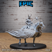 Horned sorceress mounted on a feathered skeletal-jawed beast, holding an ornate looping staff, wearing layered armour and robes, with the creature's hindquarters sweeping into dramatic blade-like plumage. Sculpt by Epic Miniatures.