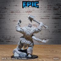 Heavily muscled giant viewed from behind, dense layered fur mantle covering the upper back, rope bindings wrapped around forearms and ankles, battle axe raised high in one hand, opposite arm extended outward, standing on a rocky scenic base. Sculpt by Epic Miniatures.