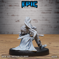 Rear view of seated female elf barbarian showing a dramatic flowing cloak billowing behind her, rope-wrapped armour on legs, and fur mantle across the shoulders. Sculpt by Epic Miniatures.