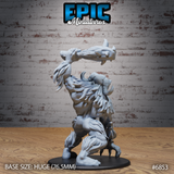 Abominable yeti crouched low with a bone club hoisted high behind its head, broad muscular back and layered fur visible, clawed feet spread wide on an oval base, deep fur texture across haunches and spine. Sculpt by Epic Miniatures.