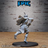 Rear view of a charging Firbolg barbarian, fur-trimmed cloak caught mid-motion behind him, fringed leg wrappings visible, a spare weapon tucked at his belt, topknot tied high. Sculpt by Epic Miniatures.