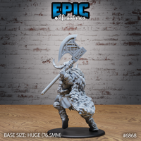 Frost Giantess gripping a rune-carved greataxe close to her chest in a two-handed combat stance, thick fur pelt visible across her back and shoulders, horned helmet prominent. Sculpt by Epic Miniatures.