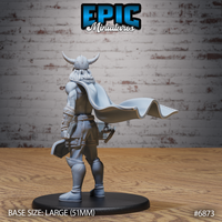 Broad-shouldered male warrior in horned helm seen from behind, long hair flowing beneath the helmet, full-length cape swept dramatically to one side, warhammer visible at hip. Sculpt by Epic Miniatures.