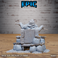 Rear view of the same seated nobleman, showing a rough-textured wooden throne chair surrounded by knotted coin sacks, arms raised holding a blade and sceptre, coin-covered base extending outward. Sculpt by Epic Miniatures.