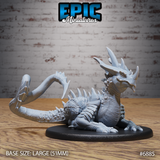 Crystal Guard Drake by Epic Miniatures, a heavily scaled drake lying low with its long tail curled behind it, dorsal spines running the body length, on a large oval base.