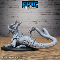 Crystal Guard Drake by Epic Miniatures viewed from the front, showing the horned head with parted jaws, bead-like neck scales, and swept crown horns, crouching on a large oval base.