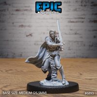 Female dark knight gripping a longsword in both hands in a close guard stance, long hair loose, wearing a fur-trimmed belted coat with a billowing cloak. Scenic rubble base. By Epic Miniatures.