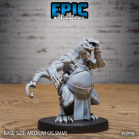 Snarling kobold blacksmith in leather apron and armoured bracers, one clawed hand raised mid-gesture, mouth open, thick ridged tail behind him. Sculpt by Epic Miniatures.
