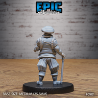 Bearded man in layered doublet and voluminous breeches seen from behind, staff gripped at his side, wide belt visible across his back. Sculpted by Epic Miniatures.