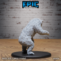 Polar bear sculpt seen from behind and to the side, standing on hind legs with one forepaw outstretched, thick layered fur texture covering shoulders and haunches. Sculpt by Epic Miniatures.