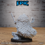 Rear view of the same armoured warrior, dominated by an enormous layered feather cloak spreading from shoulders to base, with both blades visible at the sides. Sculpt by Epic Miniatures.