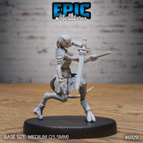 Reptilian female warrior in a deep forward lunge, thrusting a broad-guarded longsword ahead, wearing arm wraps, layered forearm plate, and a belted sash. Sculpt by Epic Miniatures.