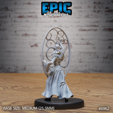 Gith Queen Spellshield by Epic Miniatures seen from behind — banded waist armour, billowing layered robes, one arm extended, surrounded by a large oval spellshield of interlocking decorative spirals.