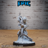 Robed cultist with one arm raised overhead, wearing a horned sun-disc mask, holding a curved blade, torso bound with rope, long frayed robes pooling at the base. Sculpt by Epic Miniatures.