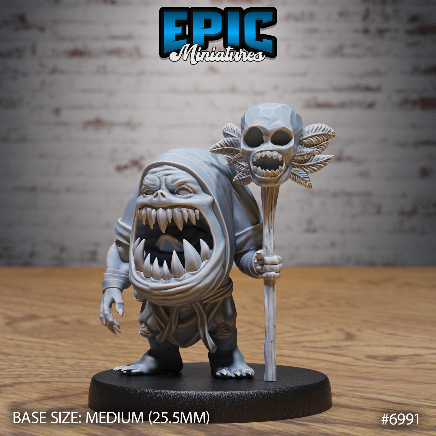 Squat, hunched fiend with a vast fanged maw for a face, clutching a tall wooden staff topped with a large angular skull surrounded by leaf-like feathers. Clawed hands, ragged layered robes. Sculpt by Epic Miniatures.