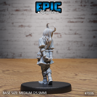 Tiefling girl miniature seen from behind, showing long flowing hair beneath two curved horns, a draped tunic belted at the waist, and hands clasped loosely at her back. Sculpt by Epic Miniatures.