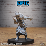 Tiefling female researcher mid-stride, wild curly hair with small horns, holding a round object in one hand and thrusting a cylindrical implement forward in the other, layered robes with pouches and a braided belt. Sculpt by Epic Miniatures.