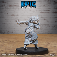 Tiefling female researcher seen from behind, curly hair and small horns visible, flowing robes with a detailed rope and braid belt, bandaged arms extended forward holding a cylindrical tool. Sculpt by Epic Miniatures.