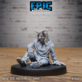 Tiefling figure seated on the ground, barefoot, one knee raised, wearing loose tattered robes with crude stitching and a circular chest scar. Long dishevelled hair, weary expression. Sculpt by Epic Miniatures.