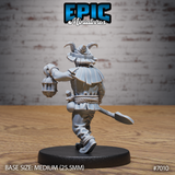 Tiefling gravekeeper seen from behind mid-stride, showing layered ruff collar, rope belt detail, wide-brimmed horned hat, and caged lantern extended outward. Spade trails behind. Epic Miniatures sculpt.