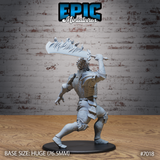 Fire giant warrior seen from behind, broad armoured back and spiked pauldrons visible, greataxe raised high with flame-sculpted blade extending above the head. Sculpt by Epic Miniatures.