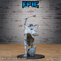 Female cloud giant seen from behind, morningstar aloft, dreadlocked hair and layered robes flowing outward, cross-laced sandals visible, standing on a rocky sculpted boulder base. Sculpt by Epic Miniatures.
