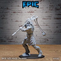 Stone giant in a wide combat stance gripping a spear at chest height with one hand, swinging a rope-and-weight weapon overhead with the other. Heavy angular armoured plates cover the lower body; the torso is bare with pronounced musculature. Grimacing face with swept-back hair and short beard. Sculpt by Epic Miniatures.