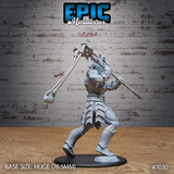 Stone giant seen from behind mid-stride, rope weapon extended overhead and arcing outward, spear held low and forward. Overlapping geometric armour plates cover the thighs, shins, and boots with scored texturing throughout. Powerfully built bare-shouldered upper body twisting into the swing. Sculpt by Epic Miniatures.