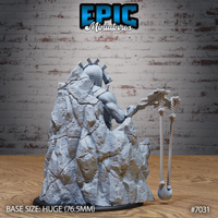 Stone giant in geometric plate armour and crossed-spar crown viewed from behind, seated on a detailed rough-hewn rock formation base, braided rope flail hanging at his side with a heavy knotted end. Sculpt by Epic Miniatures.