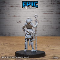 Firbolg Druid miniature seen from behind, revealing pinned hair, flowing cloth layers, engraved boot bindings, and a scabbard at the hip, staff held to one side. Sculpt by Epic Miniatures.