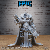 Armoured female giant raising a conjured flame in her right hand and gripping a warhammer in her left, wearing an engraved breastplate, beast-head waist armour, fur-trimmed cloak, and a crown in flowing hair. Epic Miniatures sculpt.