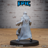 Vampire miniature seen from behind, long pale hair cascading down the back of an embroidered frock coat, clawed hands visible at the sides, coat skirts swept open mid-stride. Sculpt by Epic Miniatures.