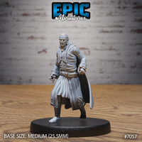 Long-haired male vampire in an ornate embroidered long coat and flowing cape, striding forward with both fists clenched at his sides, sharp-featured and composed. Sculpt by Epic Miniatures.