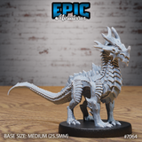 Obsidian Guard Drake by Epic Miniatures — quadrupedal draconic beast standing alert, dense overlapping scale plates covering neck and back, five-pointed swept horn crown, long segmented tail, clawed feet on a round base.