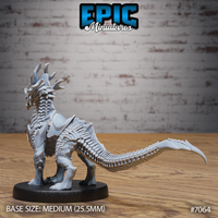 Obsidian Guard Drake by Epic Miniatures — detailed view of the creature's layered scale texture across the flanks and haunches, compact muscular body low to the ground, tail extended behind, round base visible beneath clawed feet.