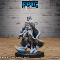 Bearded vampire sorcerer standing with one hand raised, fingers extended, wearing a layered coat and sash beneath a dramatic billowing cloak. Sculpt by Epic Miniatures.