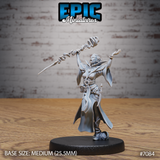 Female vampire sorceress shouting mid-cast, one arm raised overhead holding a spiralling staff with twisting energy, other hand splayed outward, long coat billowing, shortsword at hip. Sculpt by Epic Miniatures.