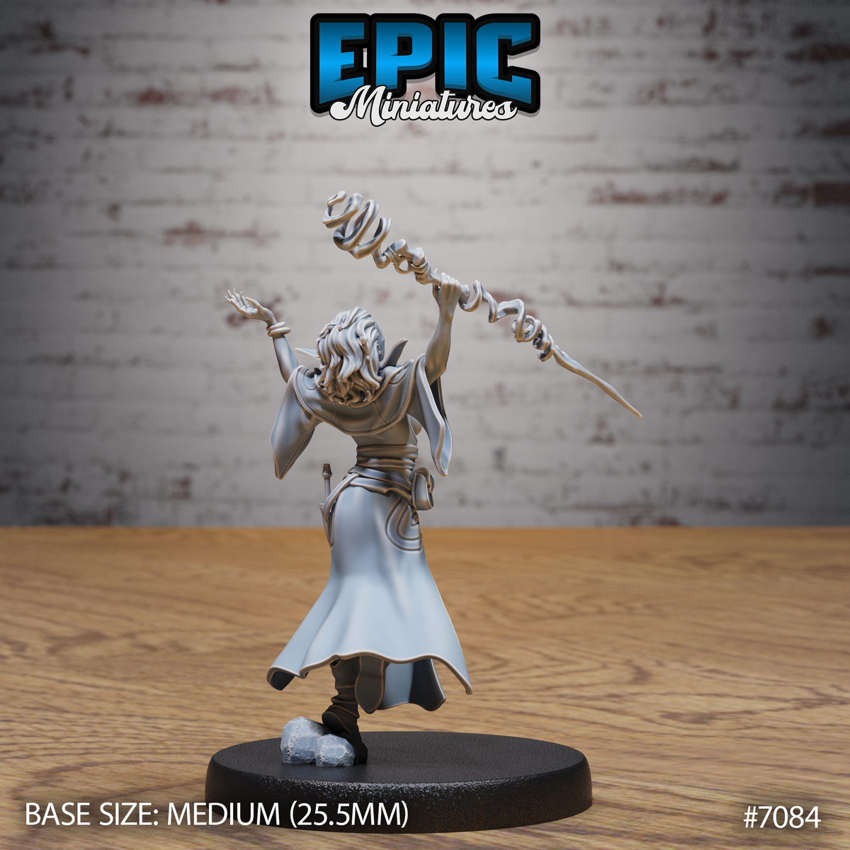 Female vampire sorceress seen from behind, arms raised with spiralling magical staff aloft, wind-swept long hair, flowing belted coat with detailed folds visible. Sculpt by Epic Miniatures.