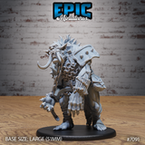 Hulking blood troll miniature leaning forward aggressively, tusked jaws open, wearing studded pauldrons and chain mail with iron shackles at its wrists, massive clawed hands reaching outward. Sculpt by Epic Miniatures.