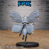 Fey Folk Queen by Epic Miniatures — rear view showing four detailed wing panels with leaf-vein tracery, two large butterfly wings above and two broad petal-shaped panels below, flowing cape spread to each side, hair rising into a pronged crown.