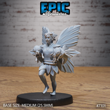 Winged fey figure walking forward, cradling two small frogs in her arms, wearing layered petal skirt and leaf-edged tunic, large veined wings spread behind her. Sculpt by Epic Miniatures.