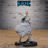 Rear view of an antlered fey knight showing an intricately layered feathered cloak covering the full back, with elongated legs and a longsword held at the side, on a rocky scenic base. Sculpt by Epic Miniatures.