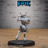 Deer folk female humanoid seen from behind, antlers and curly flower-crowned hair clearly visible, long hair cascading down her back, spotted skirt and leather belt detailed, brass knuckles held in one hand. Sculpt by Epic Miniatures.