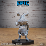 Moose-headed tribal warrior seen from behind, revealing a dense feather cloak across the shoulders and back, thick rope waist bindings, and a decorated hide kilt with carved detailing. Broad antlers visible above. Sculpt by Epic Miniatures.